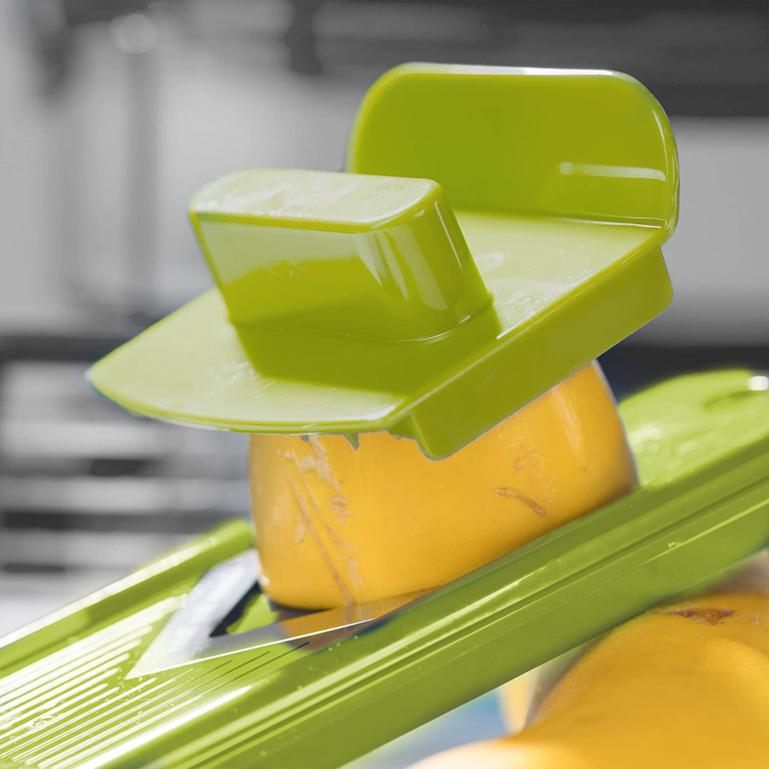 Efficient kitchen gadget: 12-in-1 vegetable slicer & dicer with storage bin for quick meal prep.