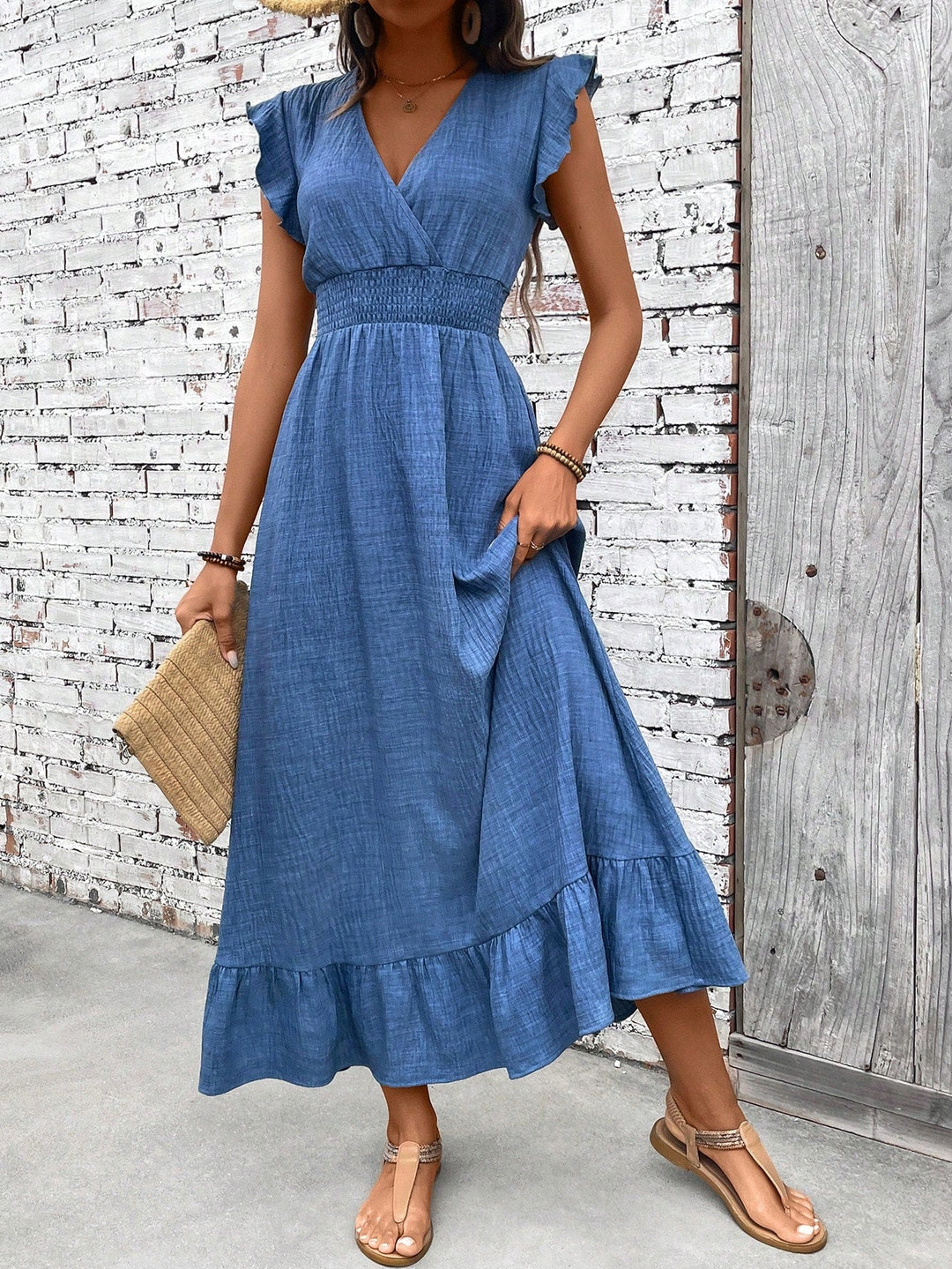 Women's bohemian blue maxi dress with smocked waist. Ideal flowy summer, beach, or casual vacation dress.