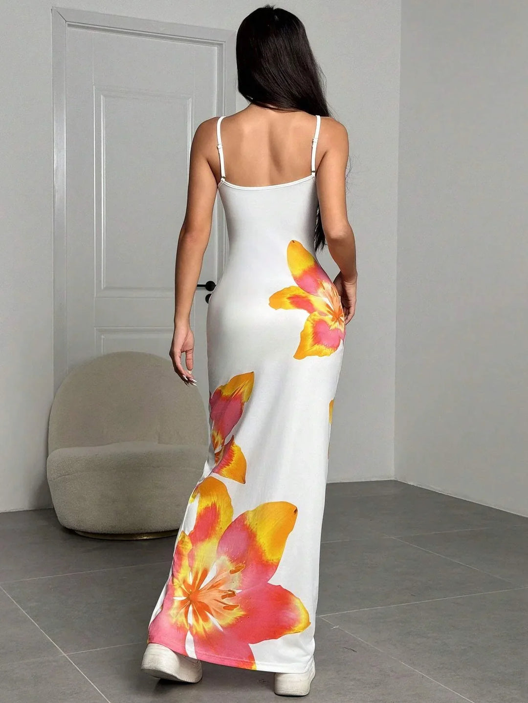 Flowing women's floral print maxi sundress, comfortable and stylish for beach or casual wear.