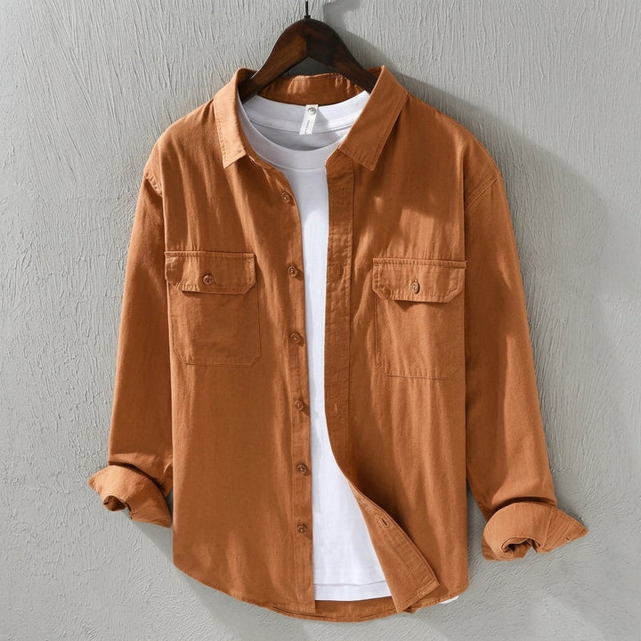 Cream men's button-up overshirt, a versatile layering shirt for smart casual outfits. Stylish & comfortable everyday wear.