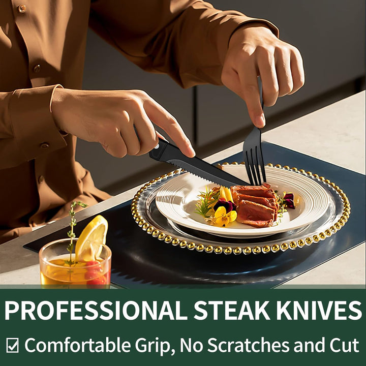 Elegant black flatware set: 24-piece stainless steel with steak knives. Ideal modern dining table setting & serveware.