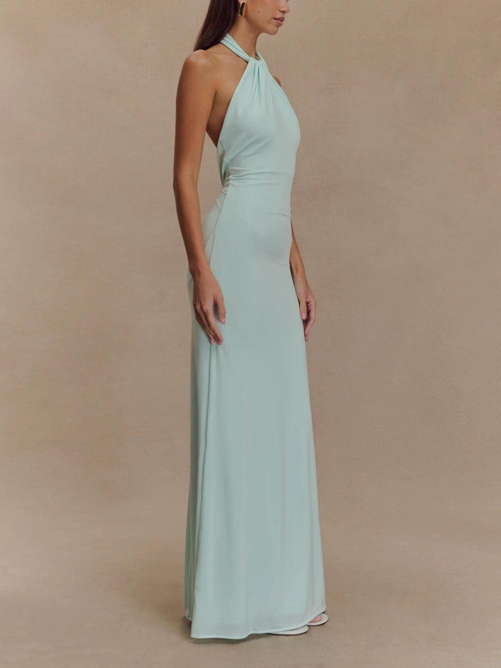 Versatile women's halter maxi dress with chic open back, a flowy sundress for both casual and elegant occasions.