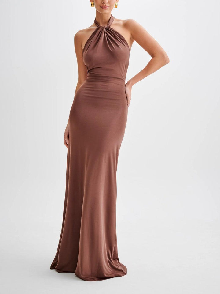 Stylish women's halter sundress, maxi length with an open back, suitable for casual wear or elegant evening events.