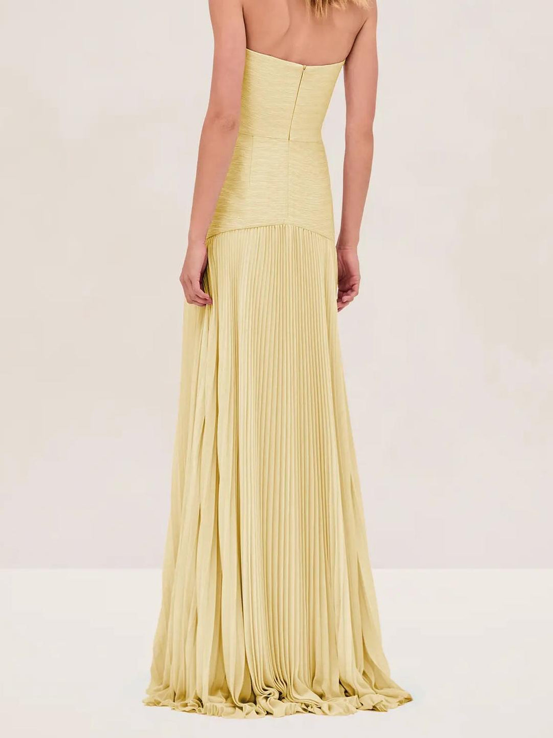 Chic yellow strapless pleated maxi sundress, women's vacation fashion for sunny summer outings.