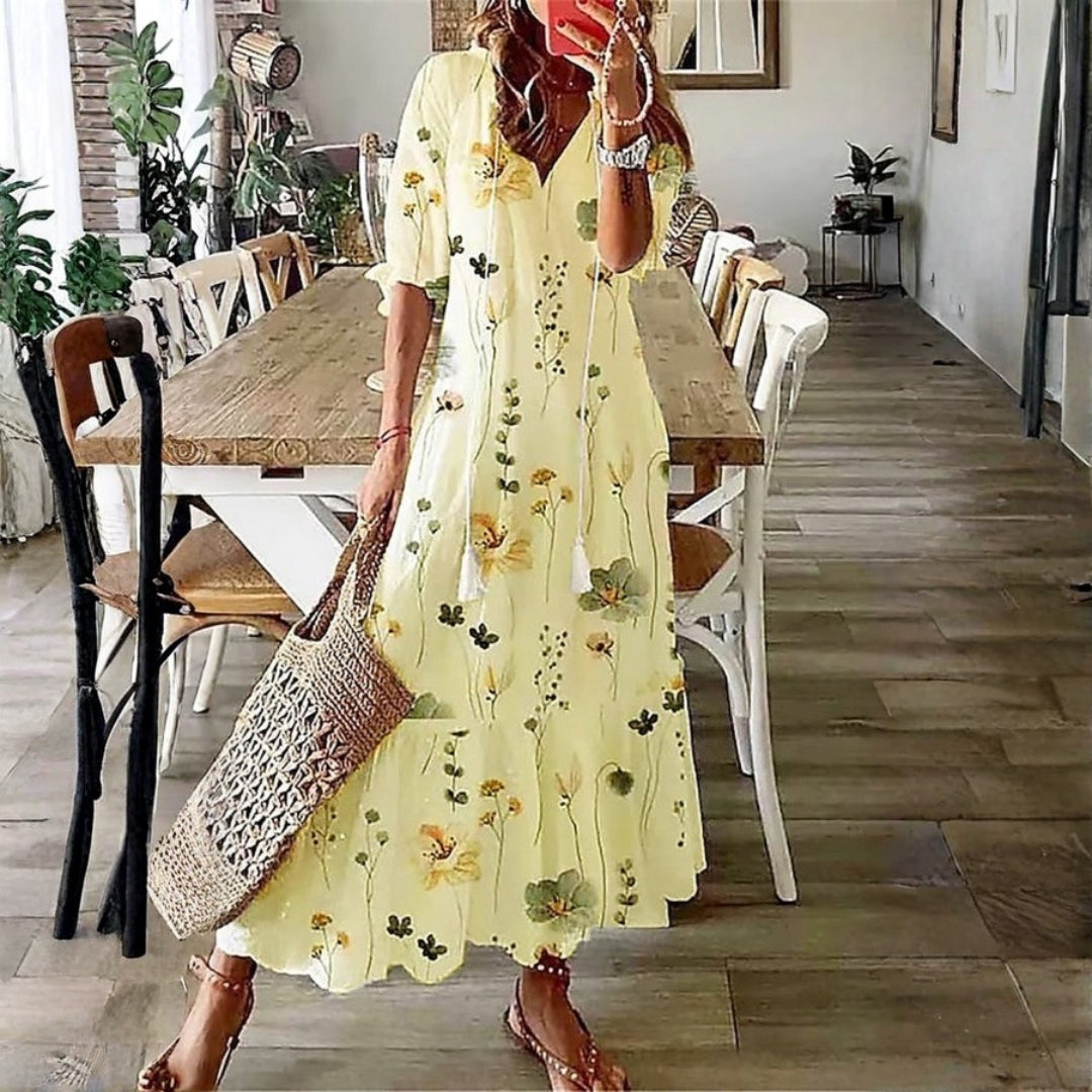 Flowy women's boho floral maxi dress, ideal for elegant beach wear or a comfortable vacation outfit.