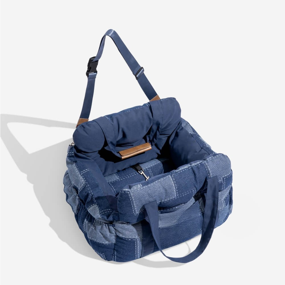 Durable dog car seat providing pet comfort & security, easily converts into a portable dog bed/carrier.