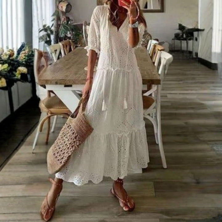 Comfortable women's summer boho maxi dress with beautiful floral patterns and short sleeves.