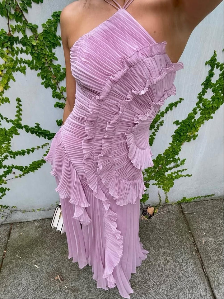 Fashionable women's evening wear: Sleeveless maxi dress for wedding guests, showcasing asymmetric pleats.