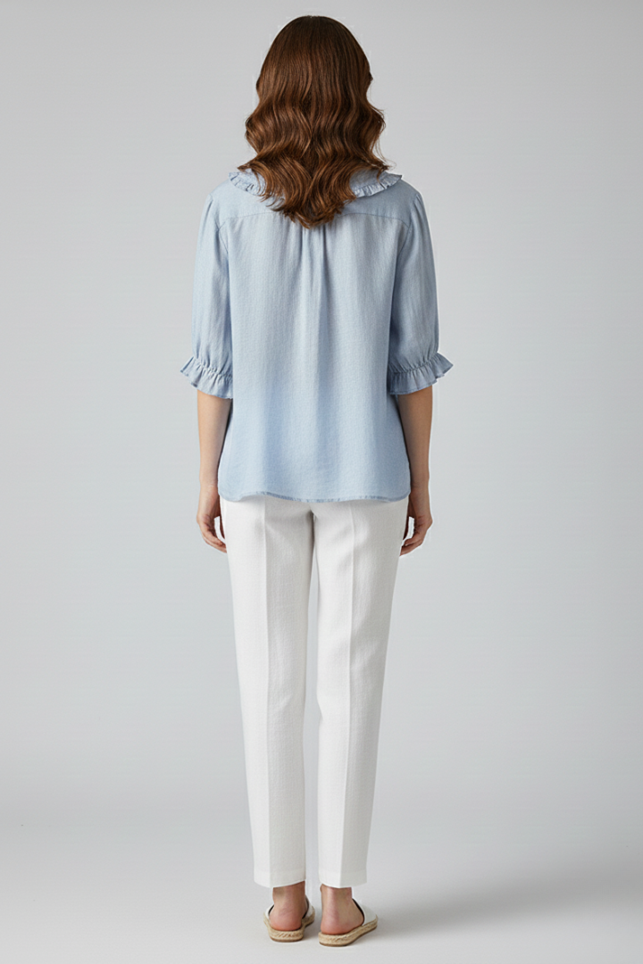 Stylish women's button-up top, an elegant ruffled blouse suitable for professional or casual spring outfits.
