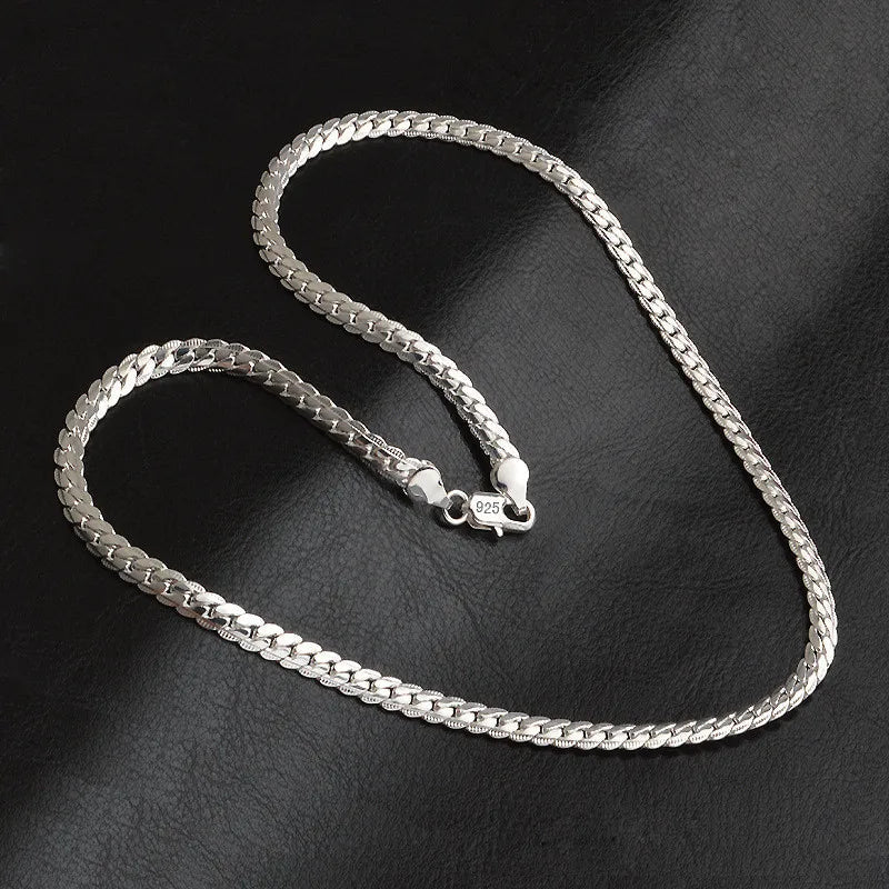 Close-up of a women's 925 sterling silver lucky pendant necklace, a timeless and elegant gift for her.
