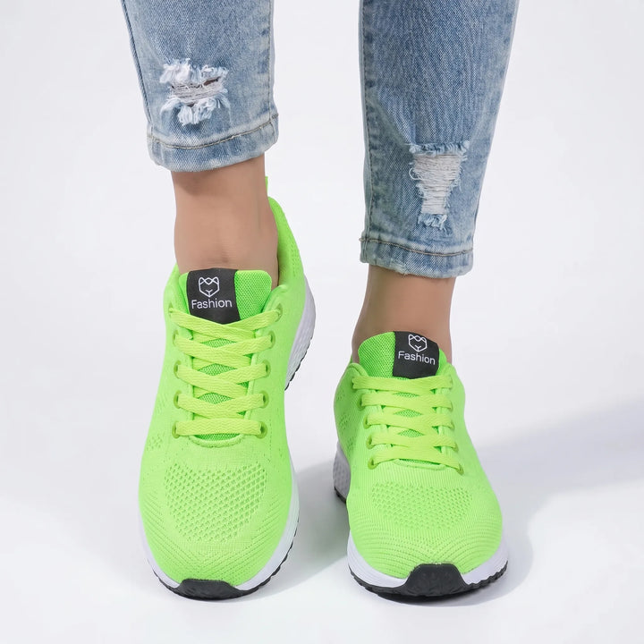 Breathable mesh unisex sneakers, lightweight and versatile for casual summer wear.