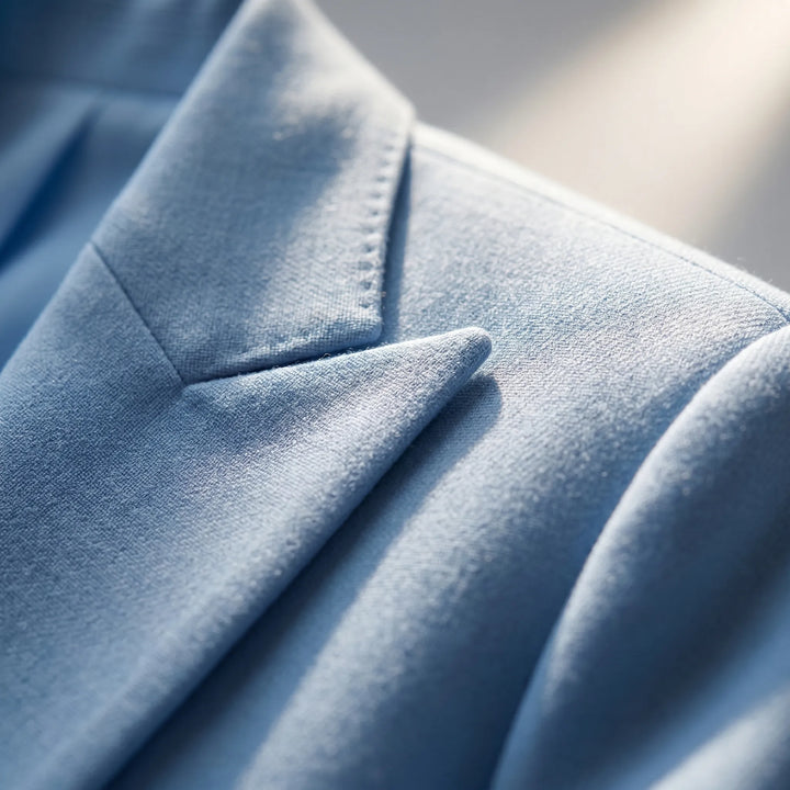 Chic women's business suit featuring a sleek tailored jacket and professional straight-leg trousers.