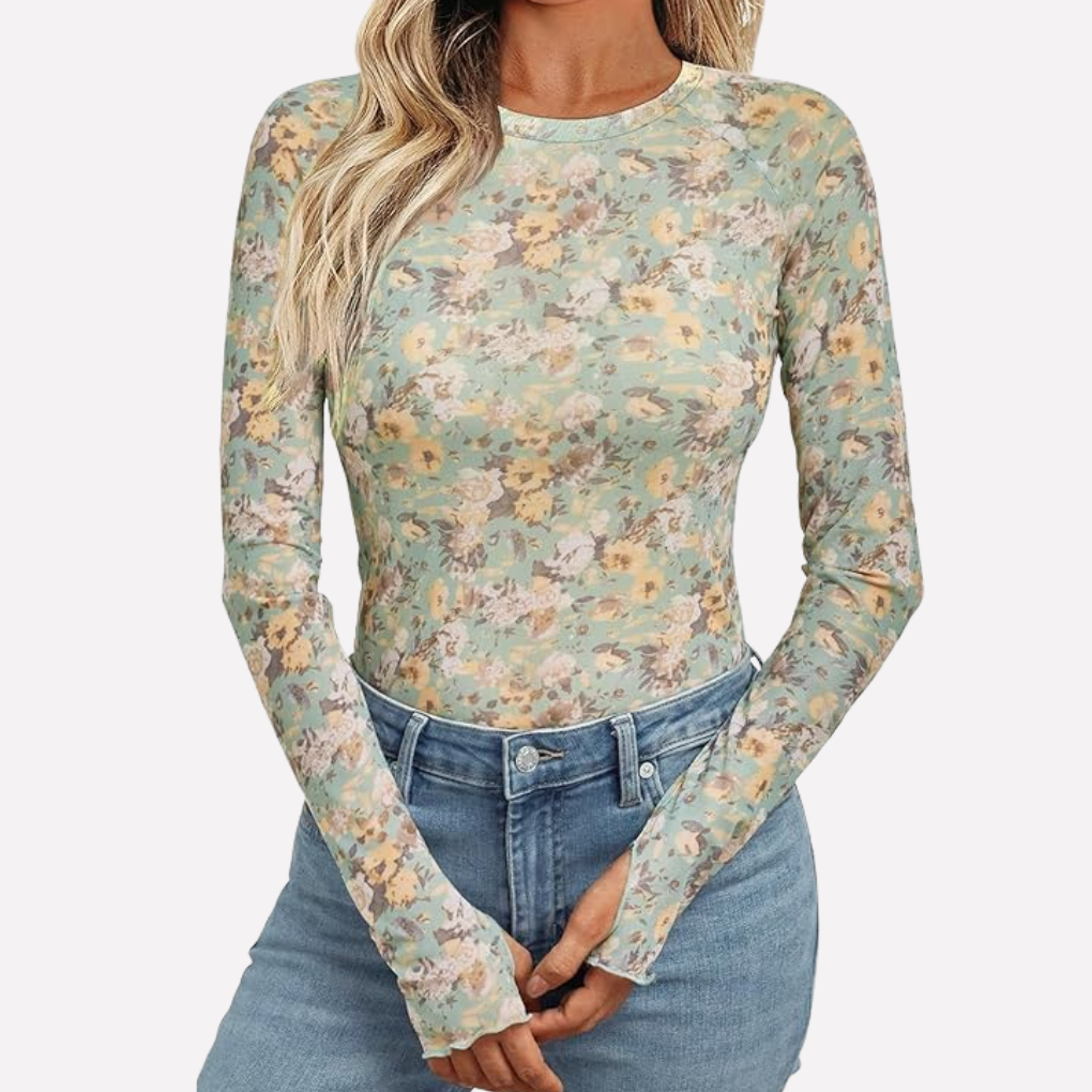 Fashionable women's elegant sheer patterned long sleeve top. Slim fit evening wear blouse for chic party outfits.
