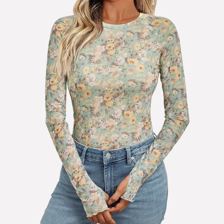 Fashionable women's elegant sheer patterned long sleeve top. Slim fit evening wear blouse for chic party outfits.