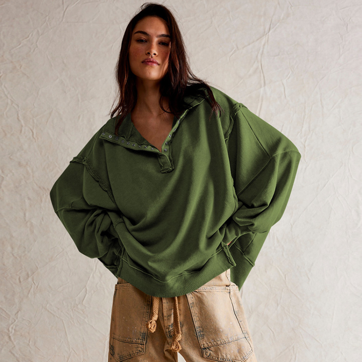 Comfortable women's oversized long-sleeve pullover with a classic henley neckline. Perfect for casual wear.