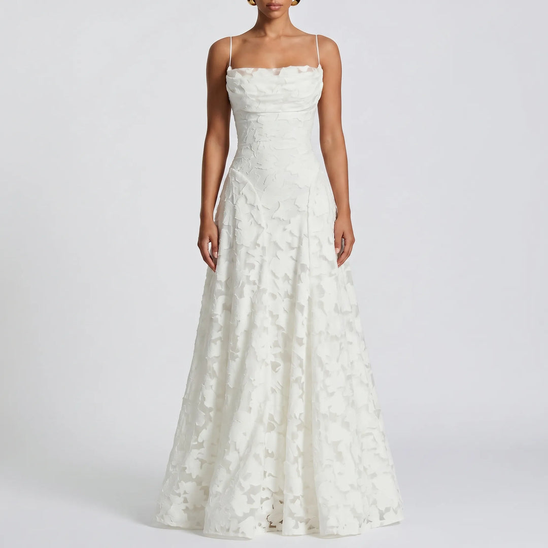 Beautiful women's floral textured maxi dress with delicate spaghetti straps, an elegant choice for evening gowns.