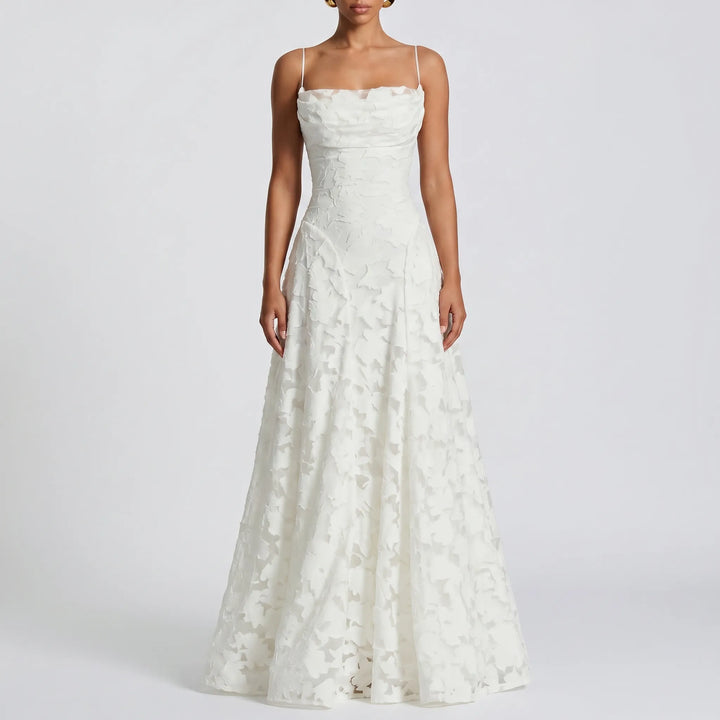 Beautiful women's floral textured maxi dress with delicate spaghetti straps, an elegant choice for evening gowns.