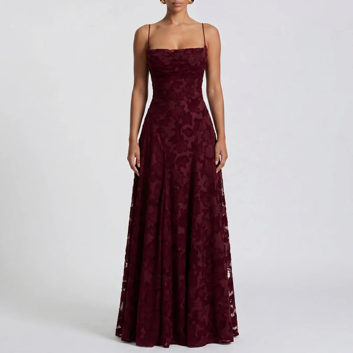 Chic women's floral maxi dress with textured fabric & thin straps. Versatile for special occasions or formal wear.