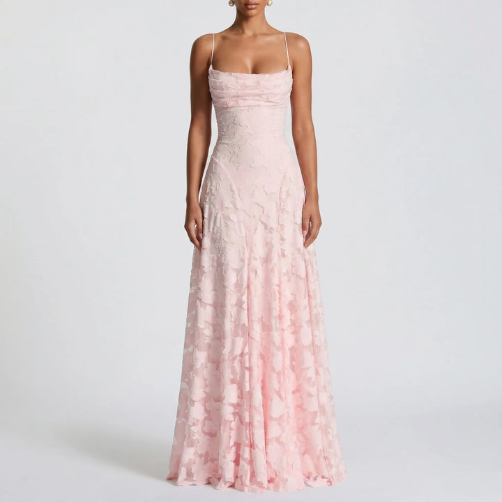 Women's elegant floral textured maxi dress with thin spaghetti straps. A graceful long gown for any party.