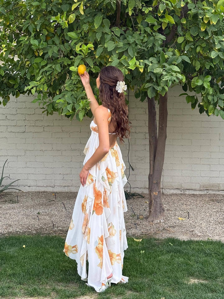 Stunning white halter maxi dress for women, featuring a chic open back and flowy design for summer fashion.