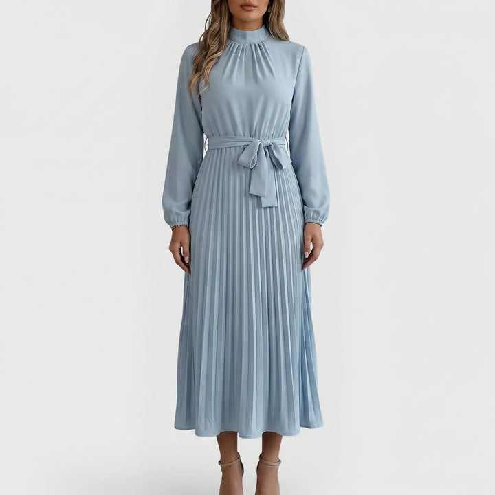 Flowy pleated midi dress for women, featuring long sleeves and a stylish tie waist. Elegant and modest.
