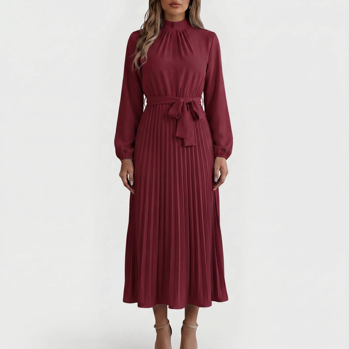 Sophisticated women's long-sleeve pleated midi dress with tie waist. Elegant office or formal wear.