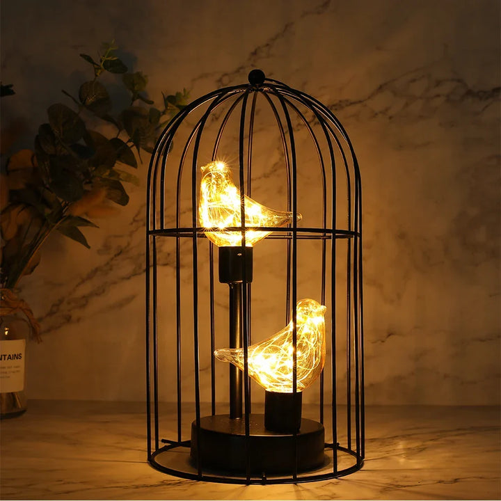 Battery operated birdcage LED lamp, cordless fairy light decor for romantic ambiance.