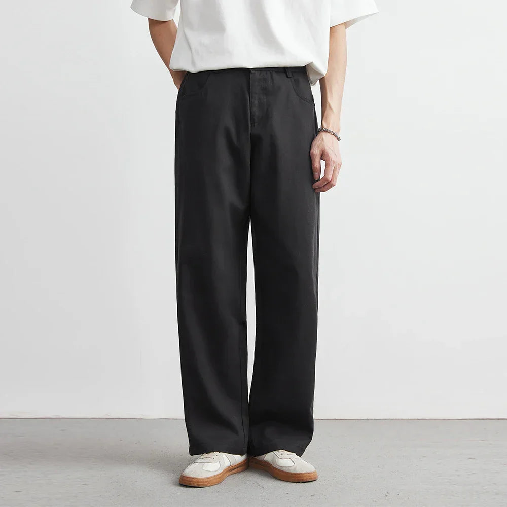 Black men's Nagano wide-leg utility pants, offering a comfortable, relaxed fit and modern casual style for daily wear.