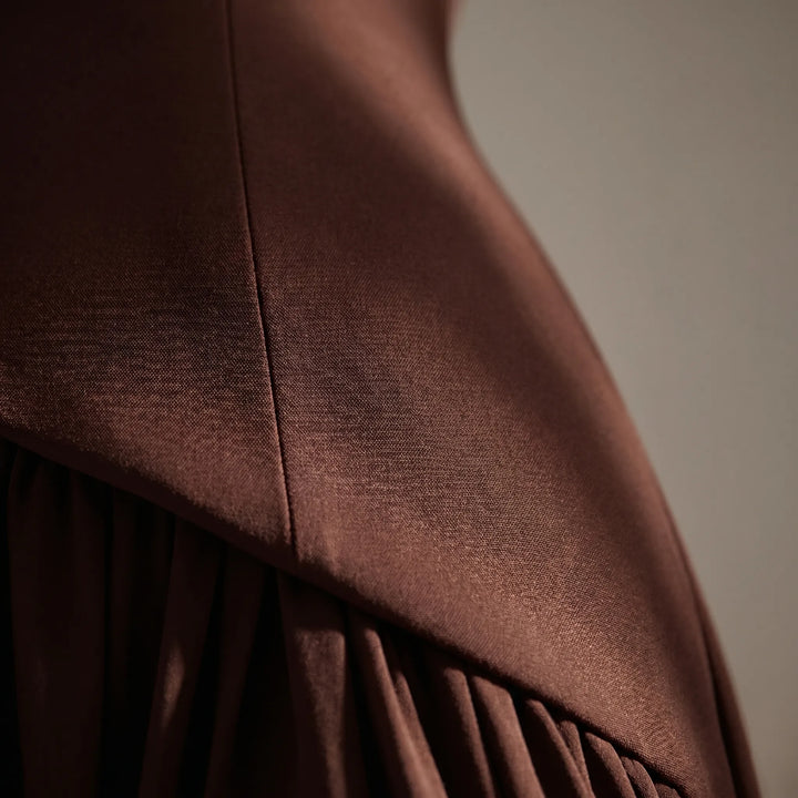 Sophisticated black tie maxi dress with a structured corset, perfect as a formal gown or evening wear.