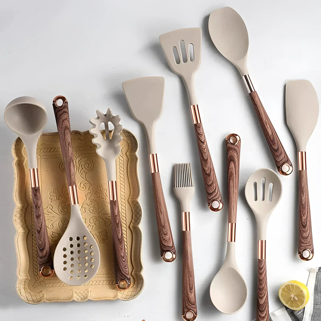 Luxury heat-resistant silicone kitchen tools set with stylish wooden handles and copper accents for nonstick cookware.