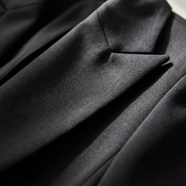 Tailored women's double-breasted blazer suit with slim trousers. Ideal for business attire & formal wear.