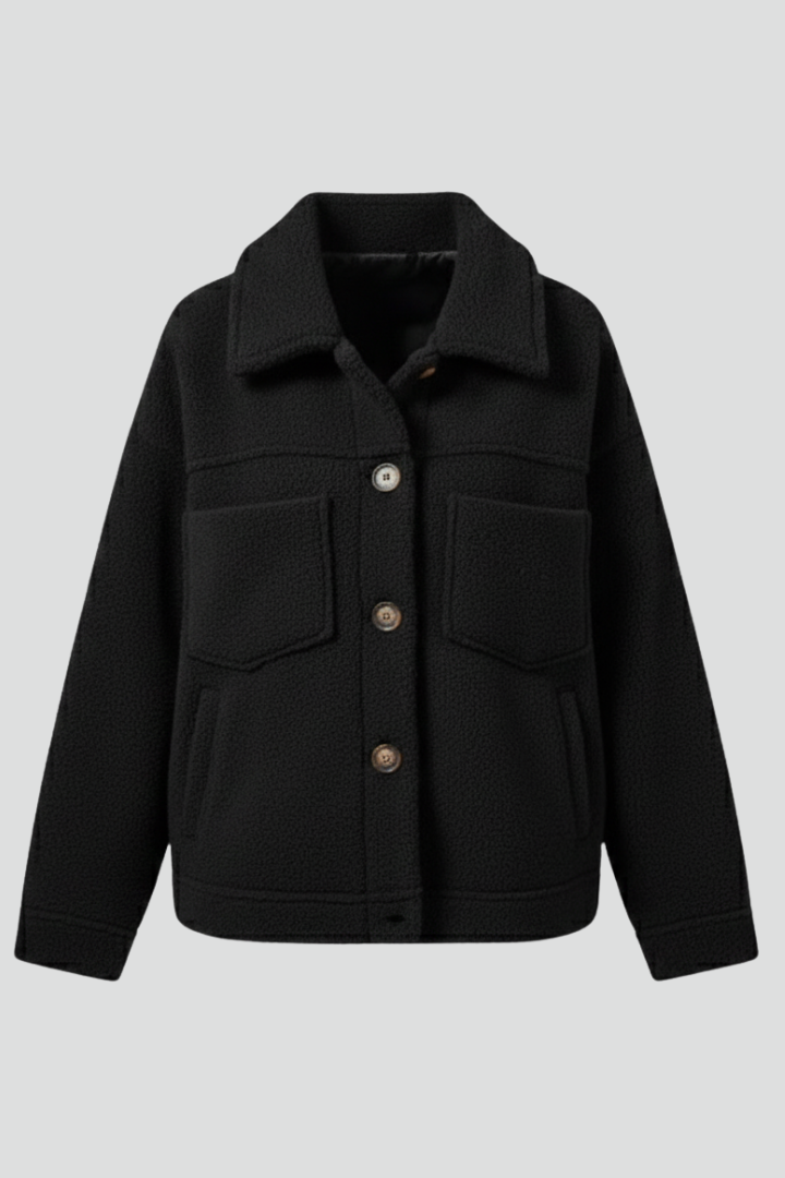 Women's cozy button-front fleece jacket with spacious pockets, perfect for everyday casual wear.
