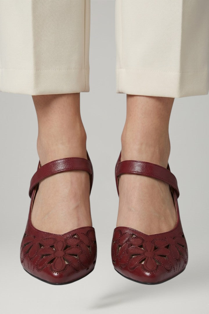 Comfortable white women's buckle heels with cushioned sole, ideal dress shoes for all-day wear.