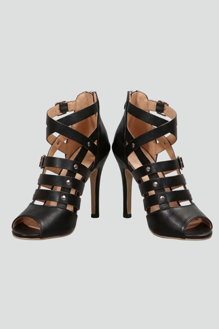 Elegant black women's stiletto sandals with a zipper closure & open toe, perfect for parties & summer evenings.