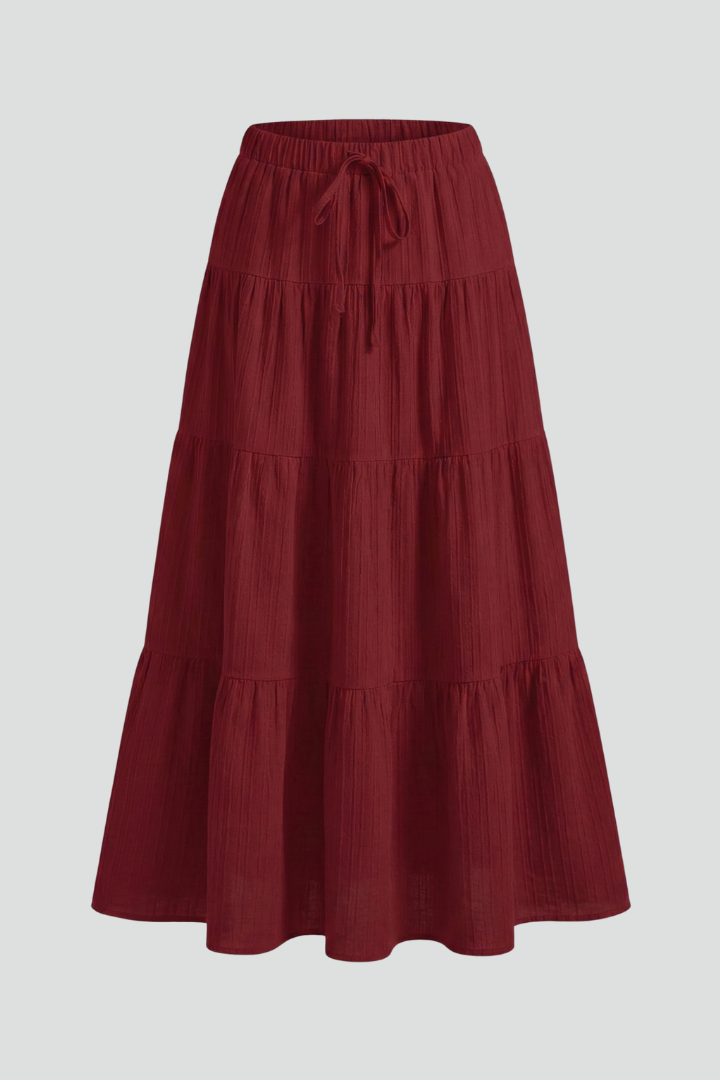 Women's flowy tiered maxi skirt with comfortable elastic waist, perfect for everyday wear.