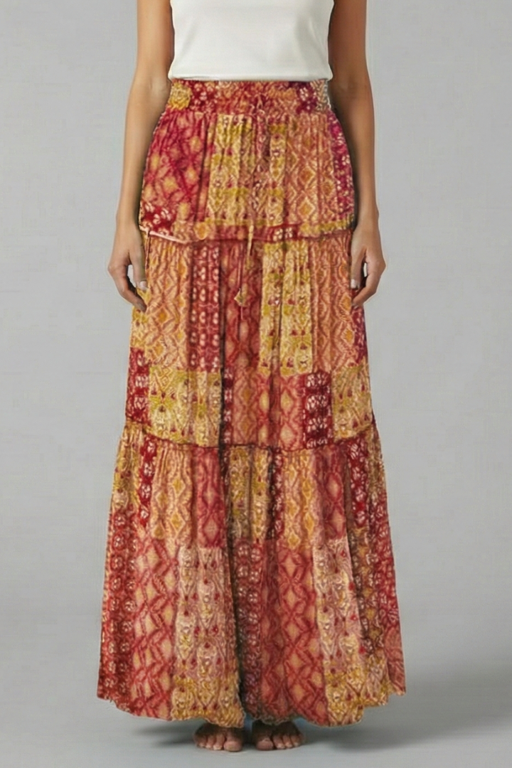 Stylish women's flowy maxi skirt with elegant tiered design and comfortable elastic waist for a perfect fit.