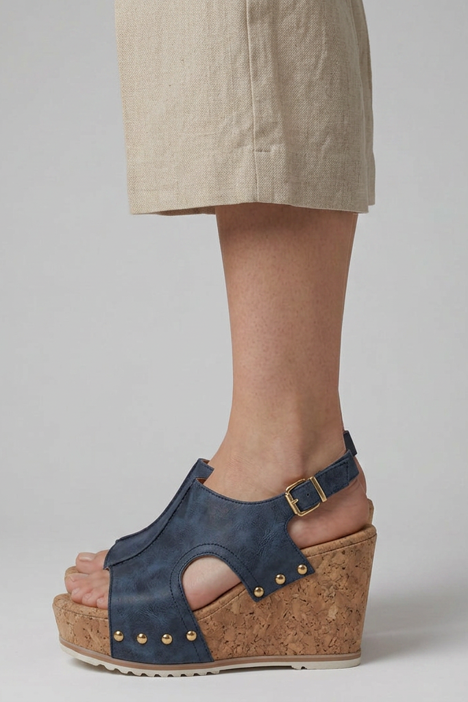 Comfortable navy blue open-toe platform wedge sandals for women. Ideal summer footwear with a secure adjustable strap.