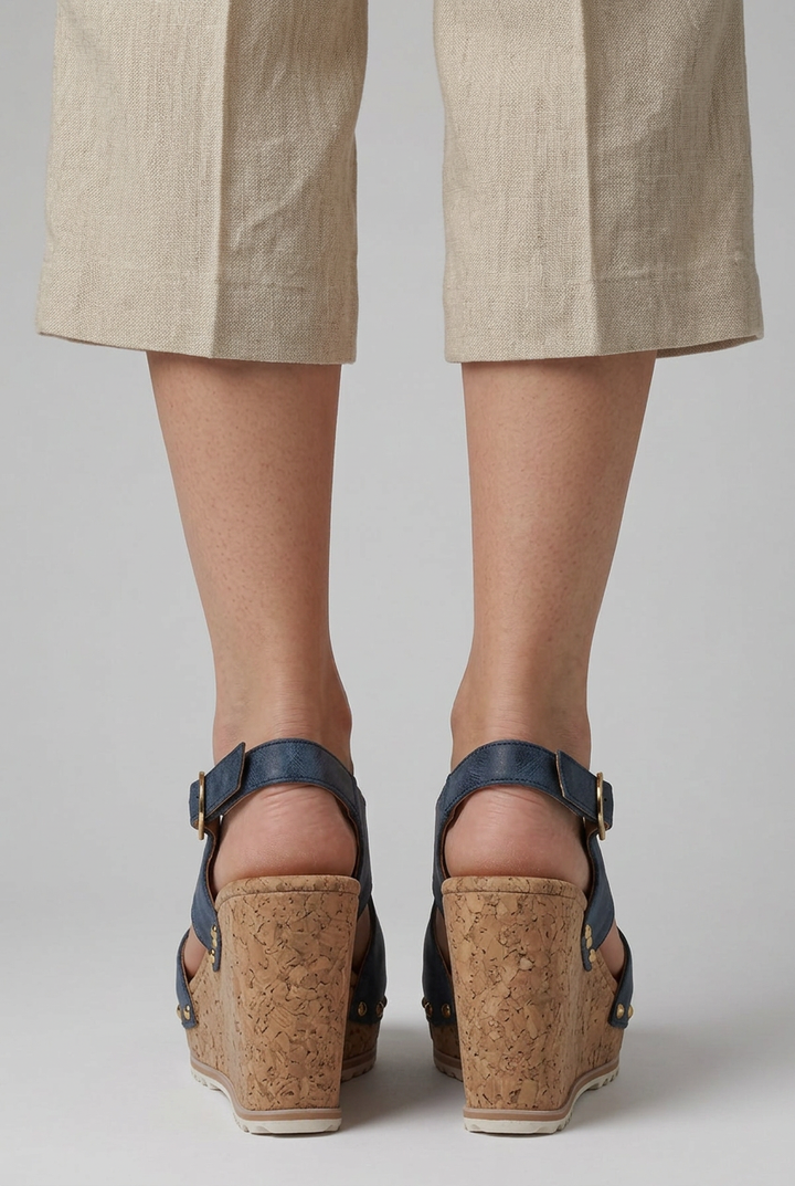 Stylish leopard print open-toe platform wedge sandals for women. Trendy summer shoes with an adjustable buckle.