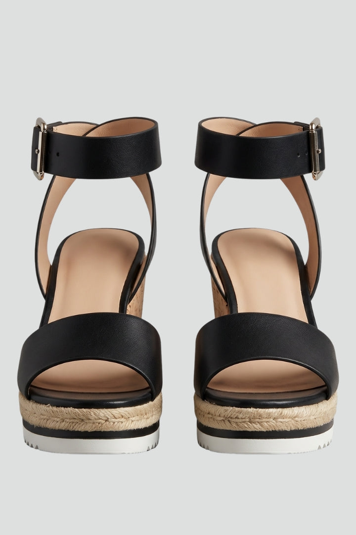 Elegant women's wedge heel sandals with secure strap fastening, perfect for summer casual or dressy outfits.