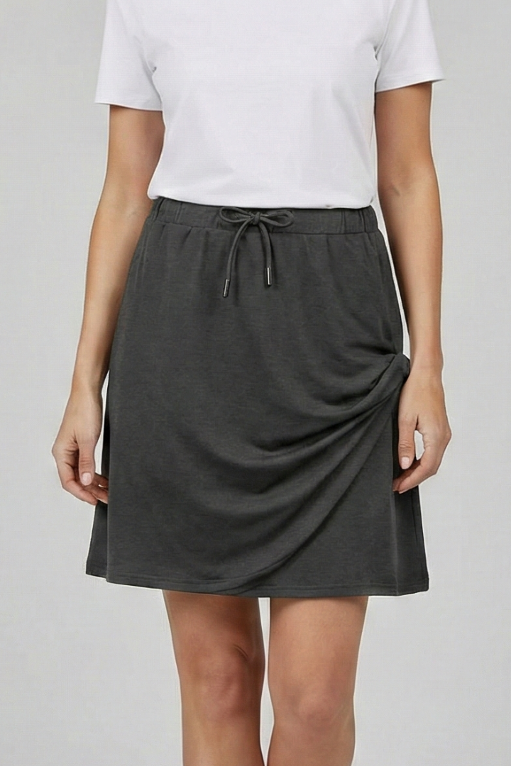 Mid-rise women's straight cut skort. Drawstring design, built-in shorts for active days.