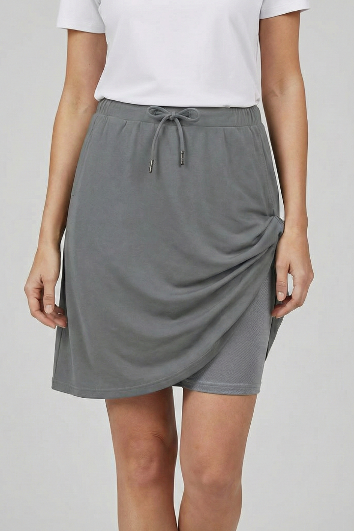 Comfortable women's drawstring skirt with built-in shorts, suitable for casual wear.