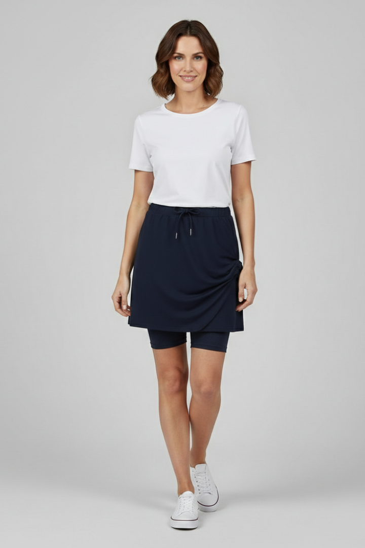 Versatile women's mid-rise drawstring skirt with built-in shorts, perfect for summer.