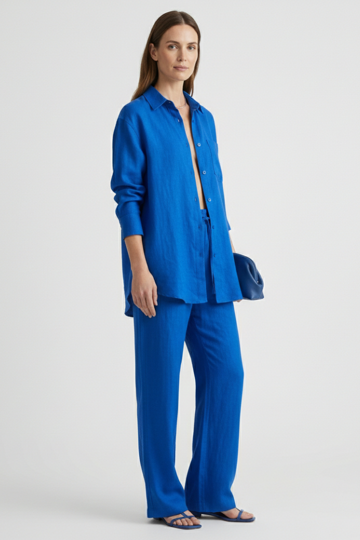 Stylish women's coordinated set with a classic button shirt and comfortable straight trousers. Modern fashion.