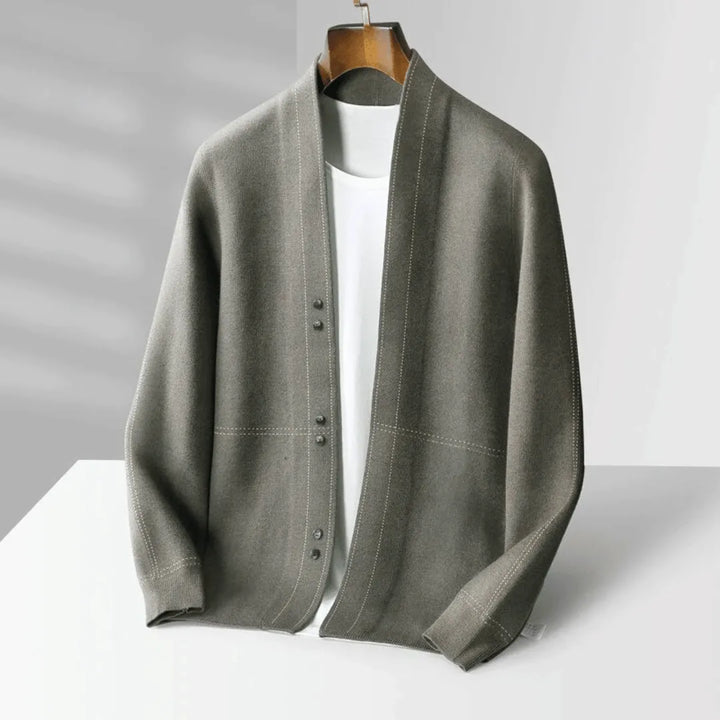 A man wearing a stylish grey knit cardigan, perfect for smart casual layering.