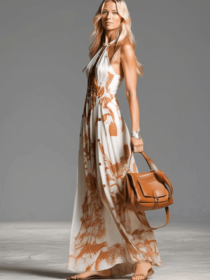 Flowy cream abstract print halter maxi dress with stylish button side split, great for summer fashion.