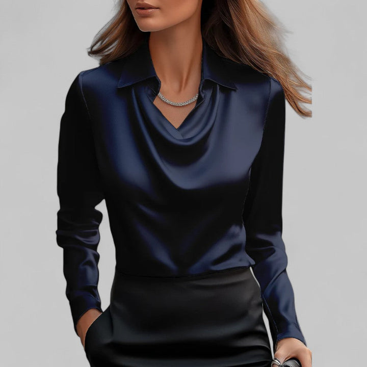 Fashionable women's draped neck long sleeve blouse with a relaxed fit. Great for a sophisticated look.