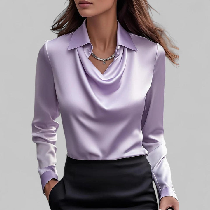 Stylish women's long sleeve blouse featuring a draped neck. Offers both elegance & comfort for modern fashion.