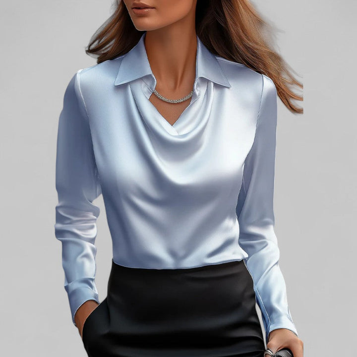 Women's draped neck long sleeve blouse. Elegant and comfortable top for various occasions.
