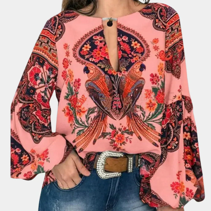 Feminine women's blouse with a delicate floral print, offering a breezy and comfortable summer feel.
