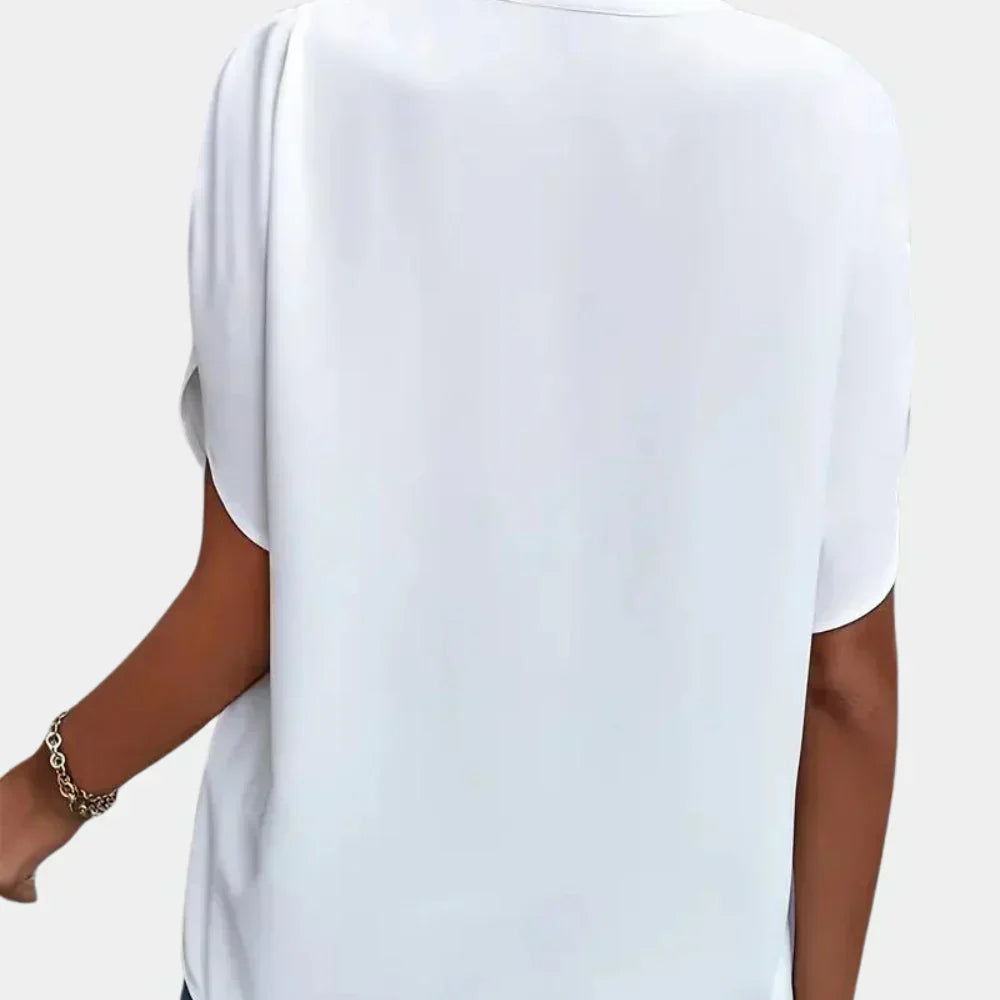 Feminine short sleeve summer blouse, stylish and comfortable for women's everyday wear.